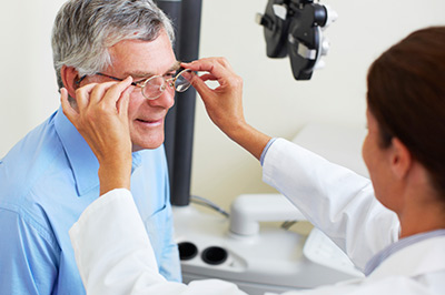 man getting fitted for glasses