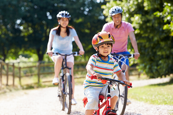 Family riding bikes